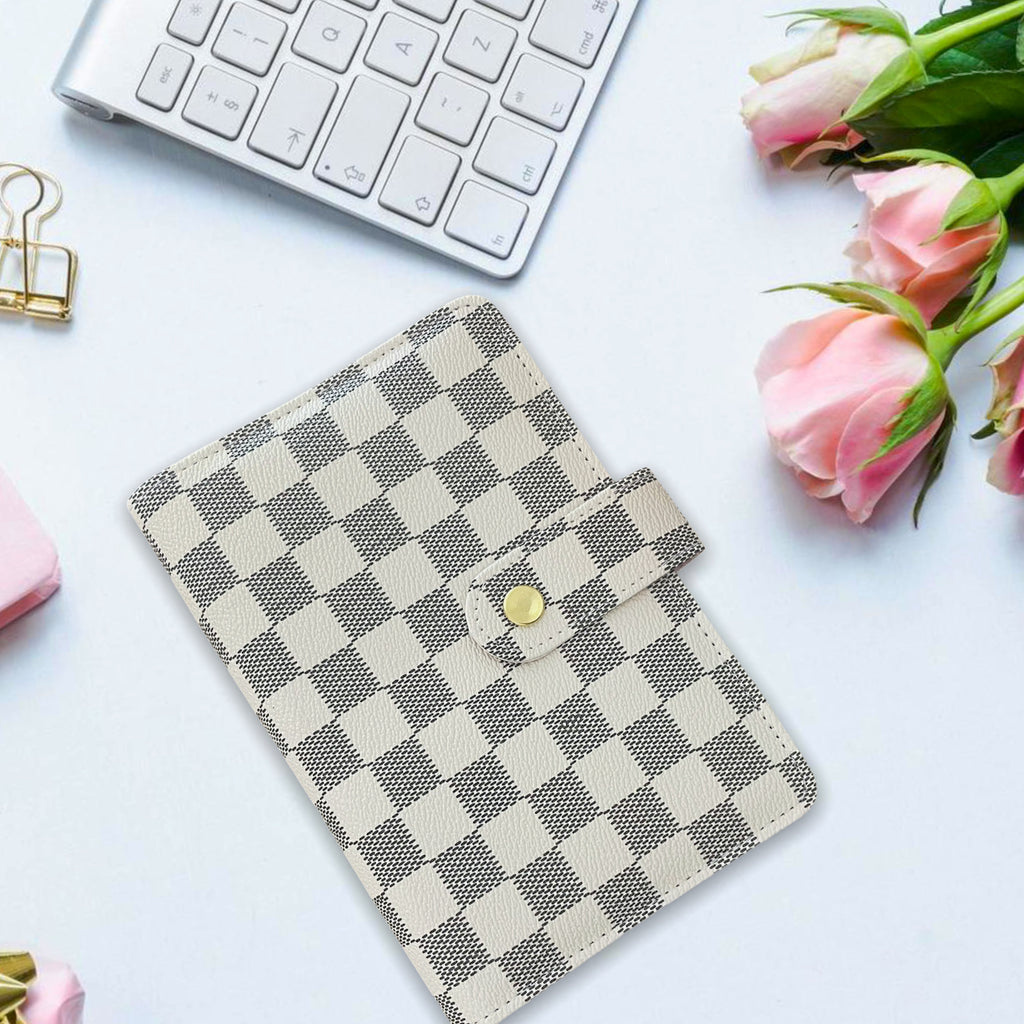 alt="checkered white and grey dupe planner"